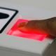 A U.S. visa applicant is fingerprinted by a visa clerk at the U.S. Consulate in Tijuana, Mexico Monday, March 12, 2007.